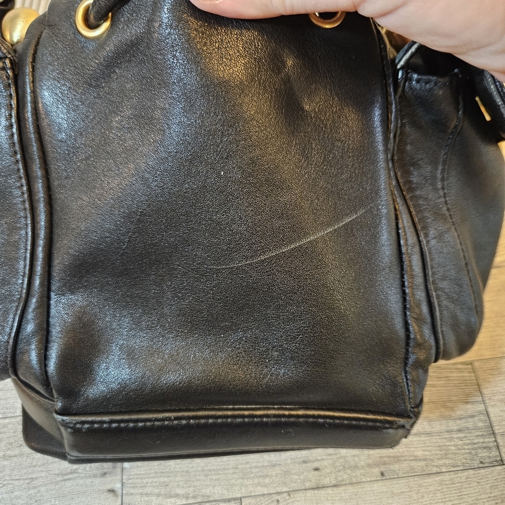 Sabina Black Leather Drawstring Shoulder Bag with Gold Accents - Picture 16 of 16
